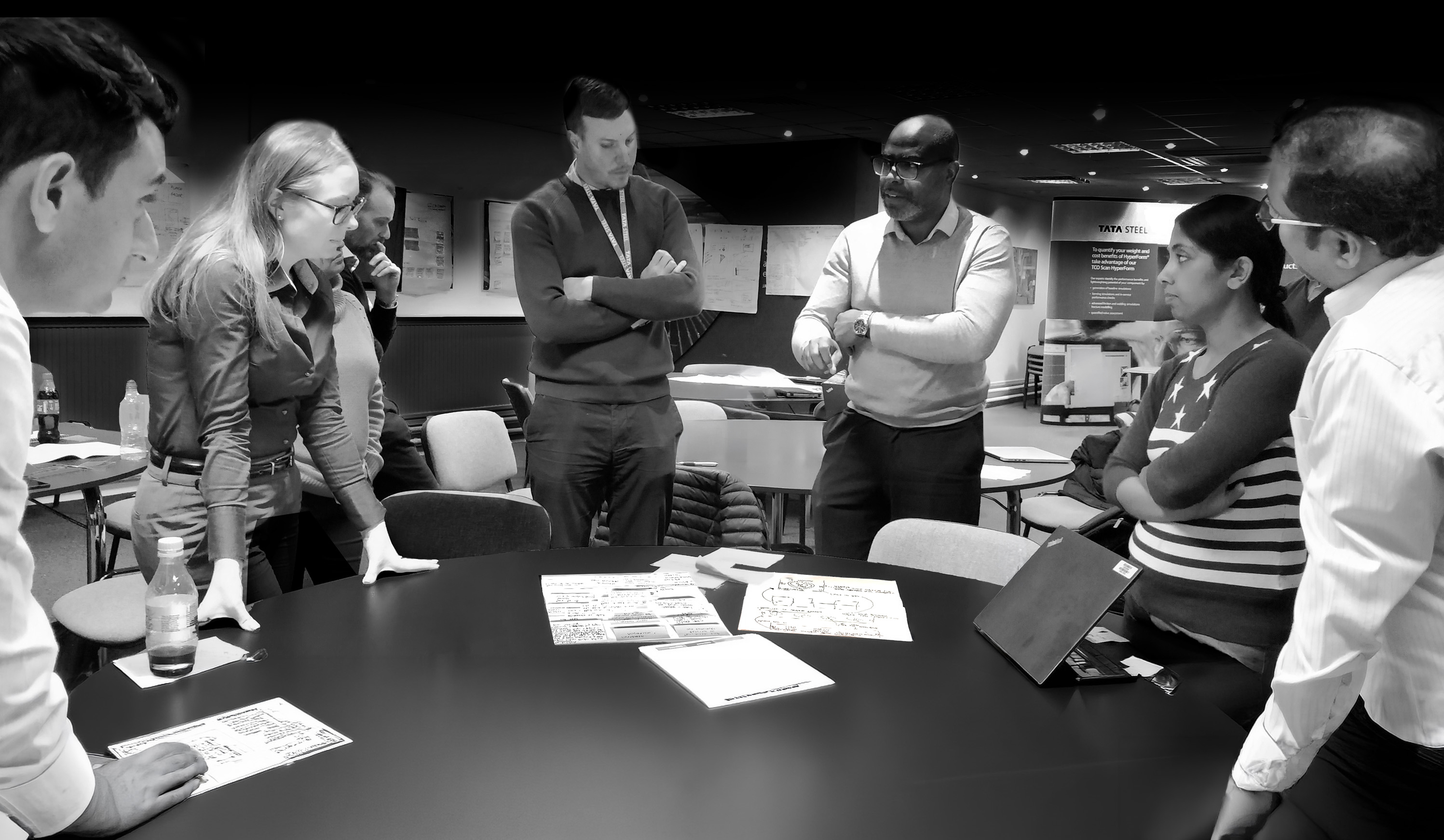Team collaborating around a table during a discovery workshop